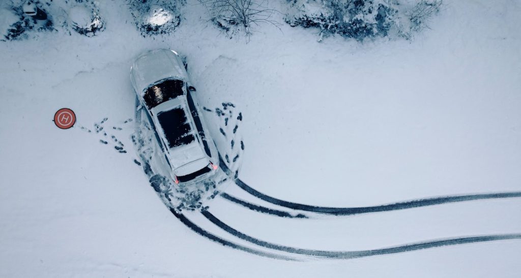an aerial view of a car in the snow