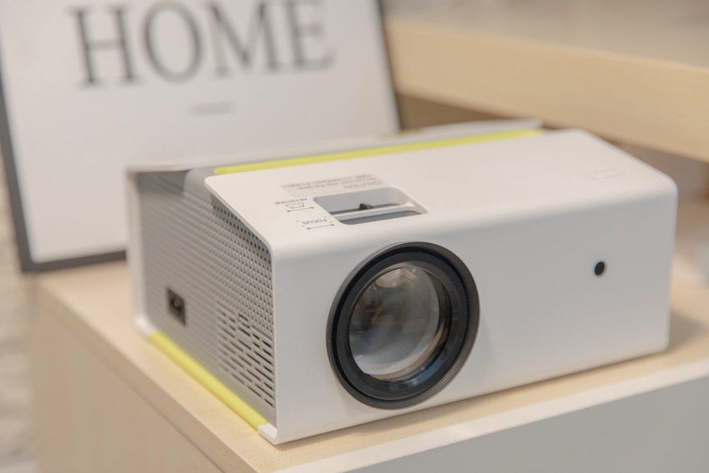 a white projector sitting on top of a table