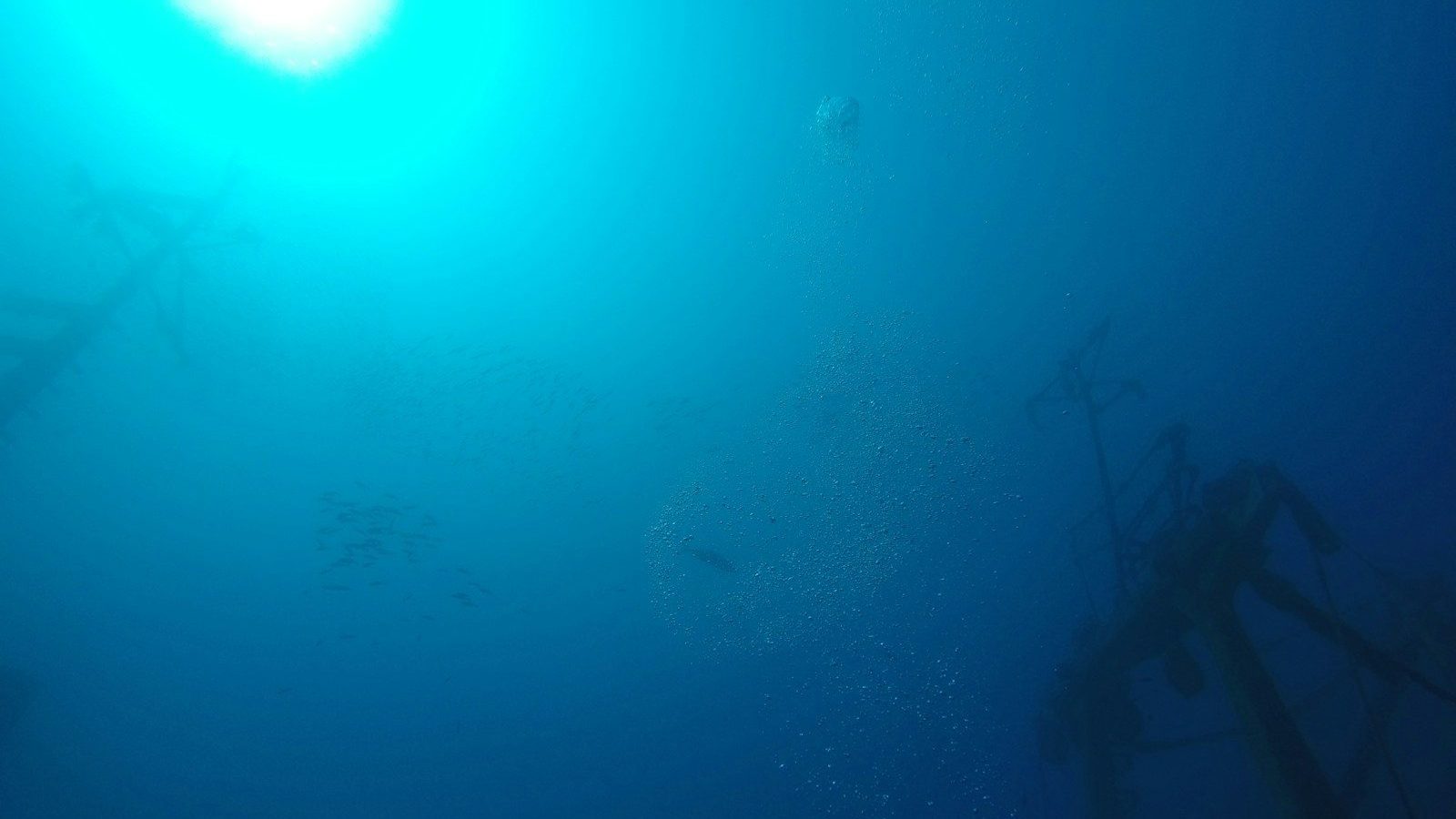 the sun shines brightly in the blue water