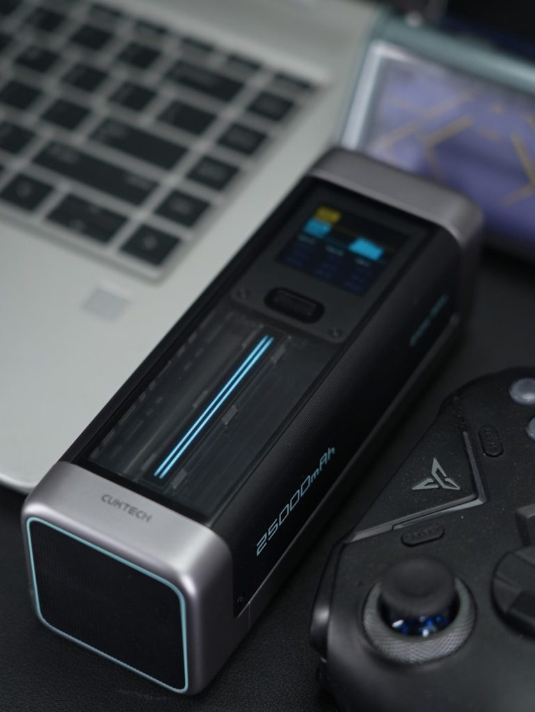 A tech device with display and controller.