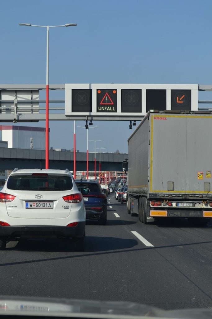 Traffic jam with an accident warning sign.