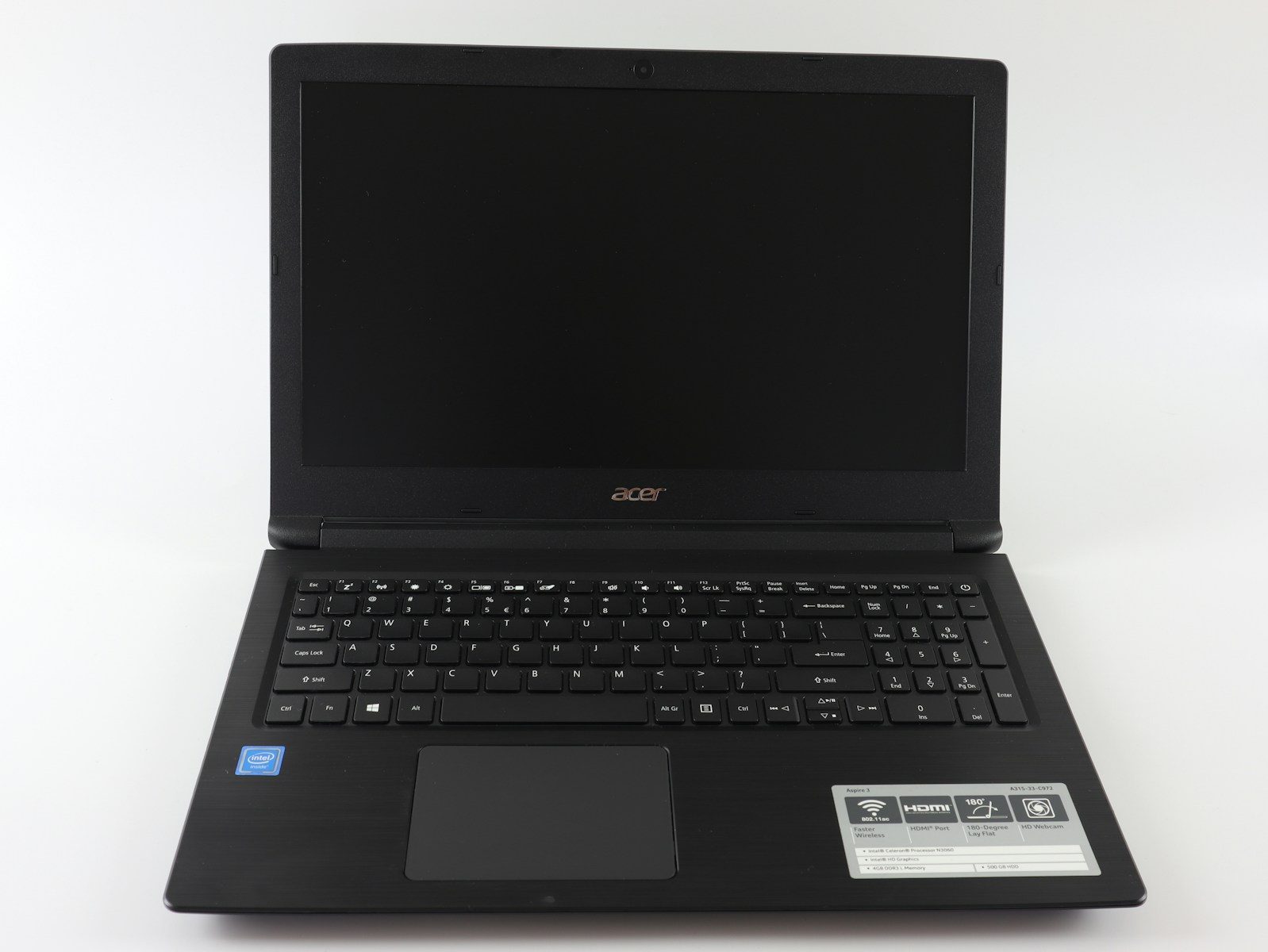 a laptop computer sitting on top of a white table