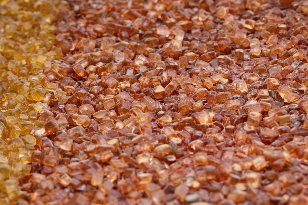a close up of a mixture of brown and yellow crystals