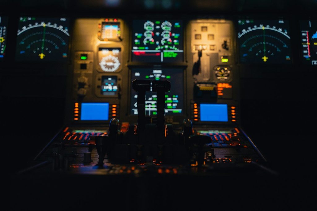 a control room with many screens