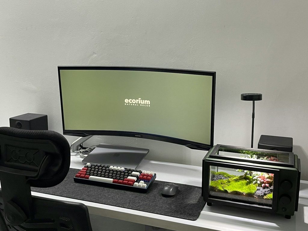 a computer monitor sitting on top of a desk