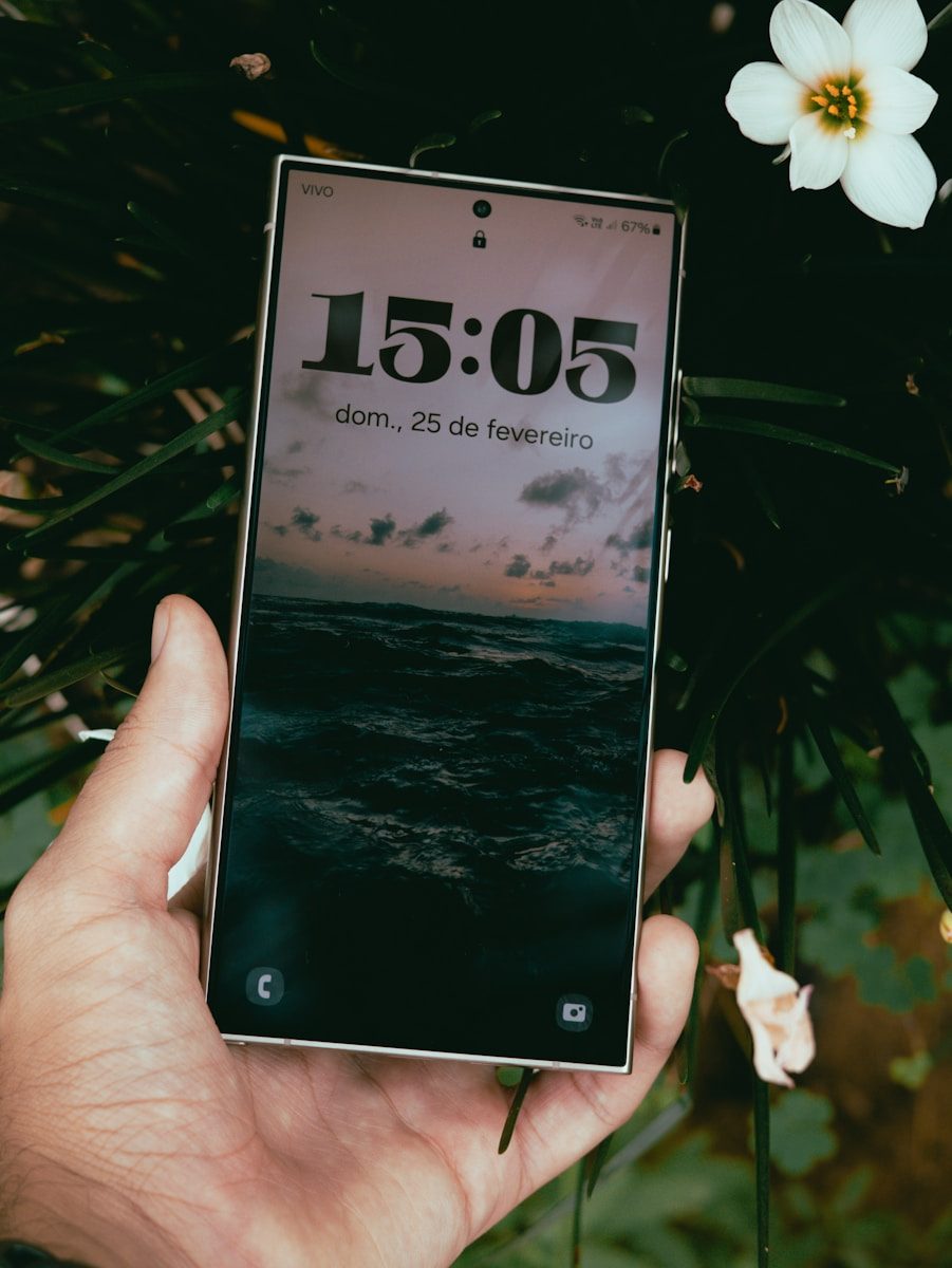 A person holding a cell phone in their hand
