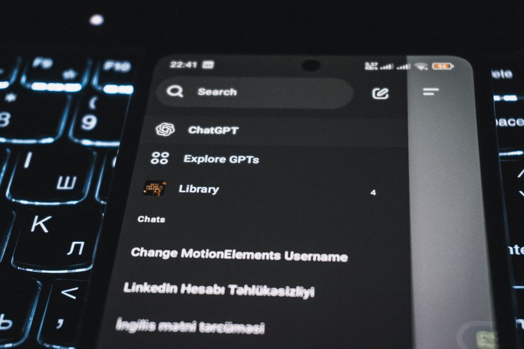 Smartphone screen displaying chatgpt interface on keyboard