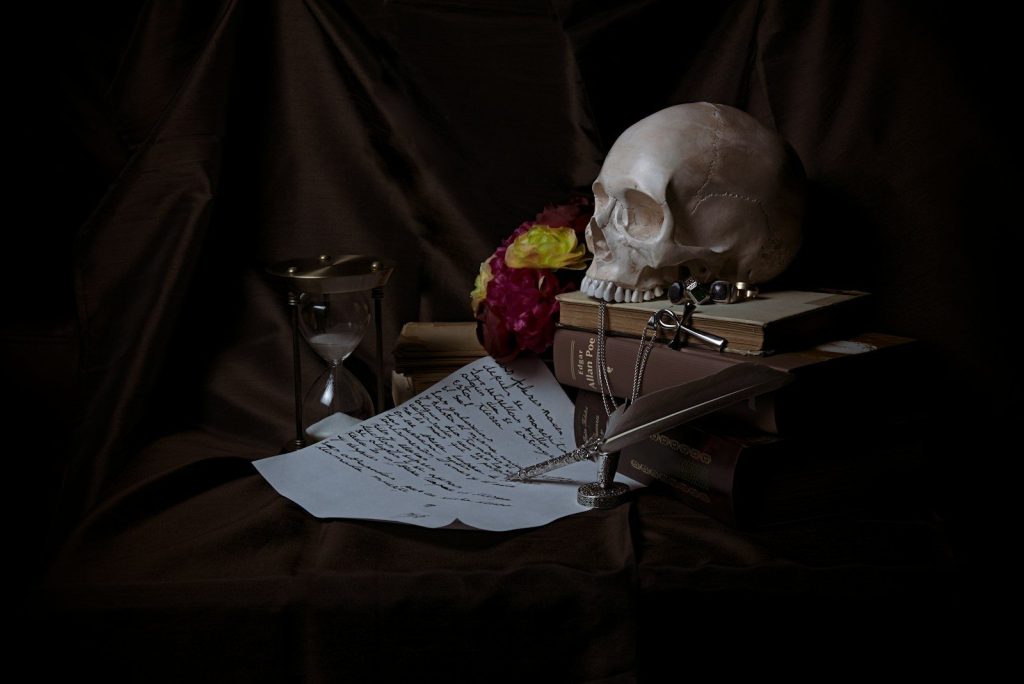 white and black printed paper on brown wooden table
