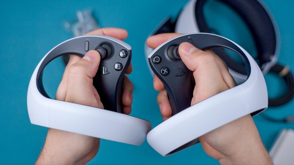 a person holding a video game controller in their hands