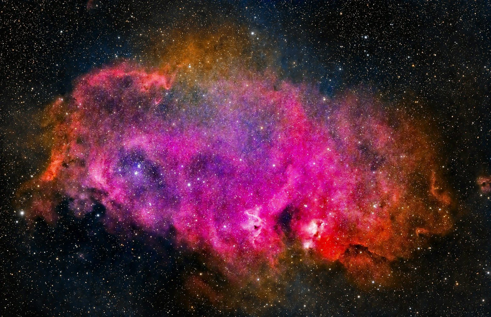 A colorful object in the middle of the night sky