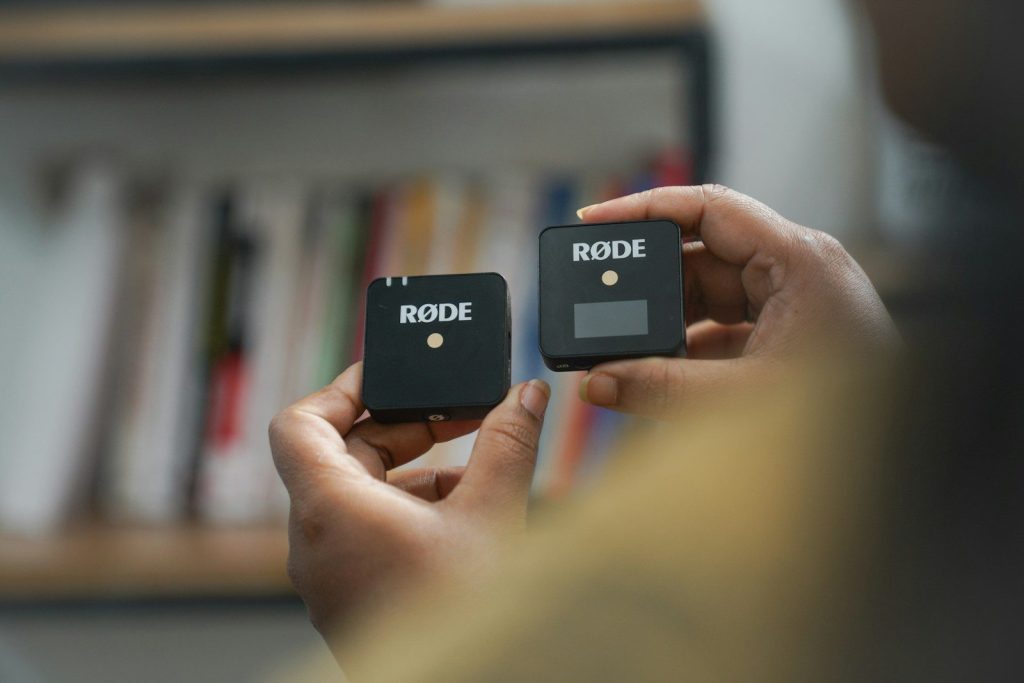 a person holding a remote control in their hand