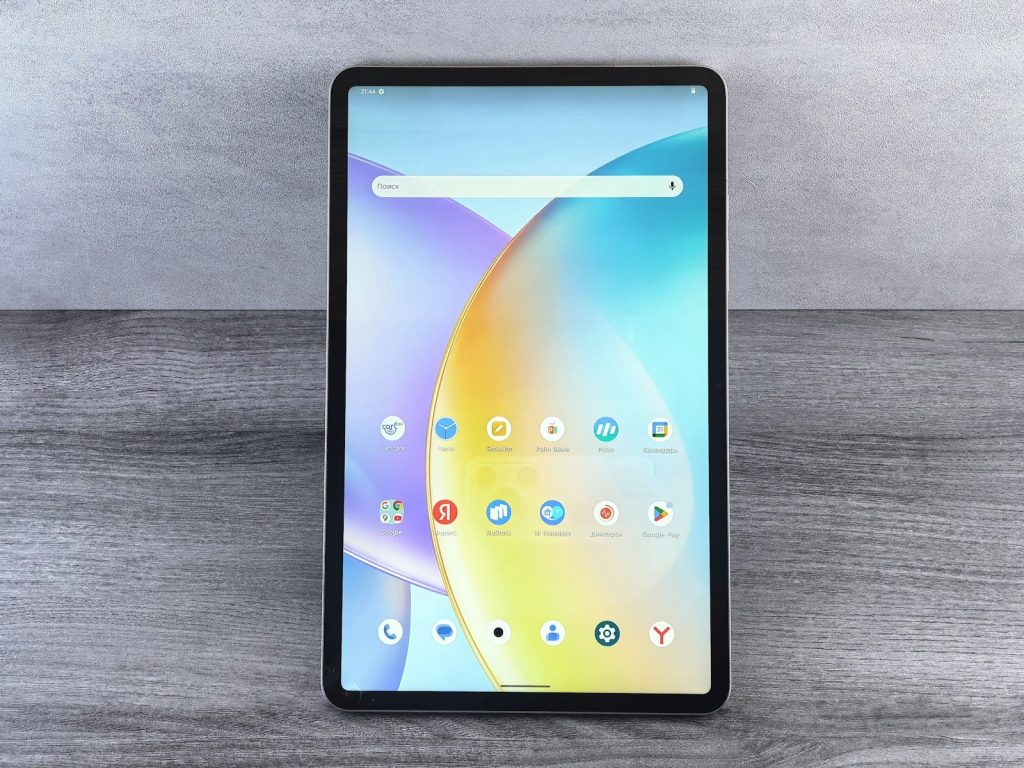 A tablet displaying a colorful abstract wallpaper