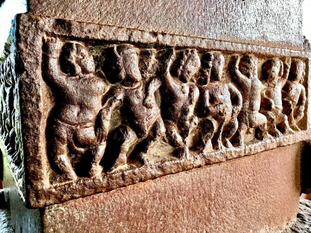 a carving of a man and a woman on a wall