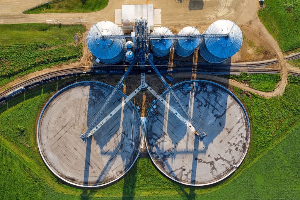 An aerial view of industrial silos and agricultural fields in rural Randolph, Minnesota.
