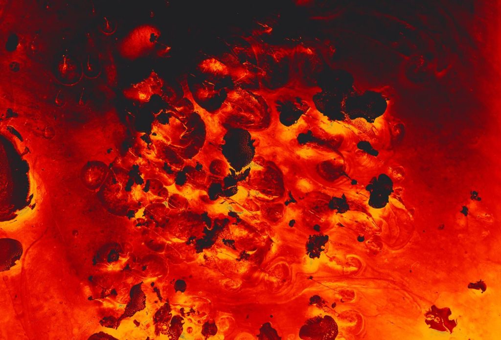 Close-up view of vibrant molten lava with rough textures and glowing colors.