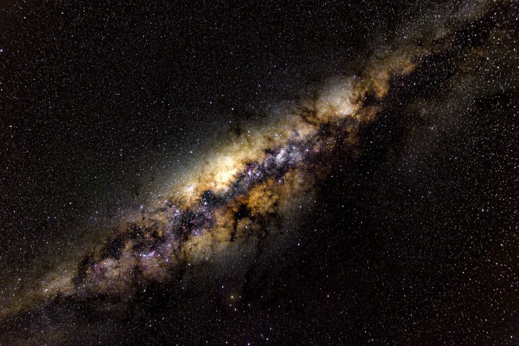 A breathtaking view of the Milky Way galaxy showcasing its vibrant star formation and cosmic dust clouds.