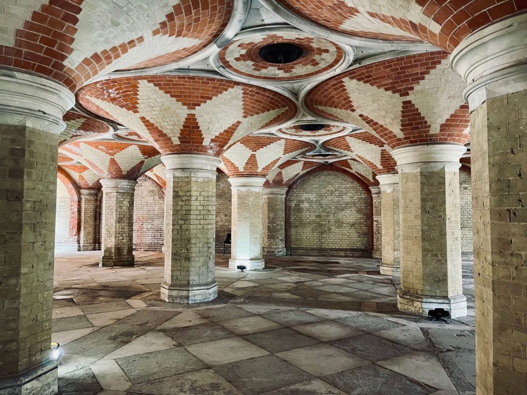 Explore the stunning brickwork and vaulted ceilings of this historic architectural crypt.