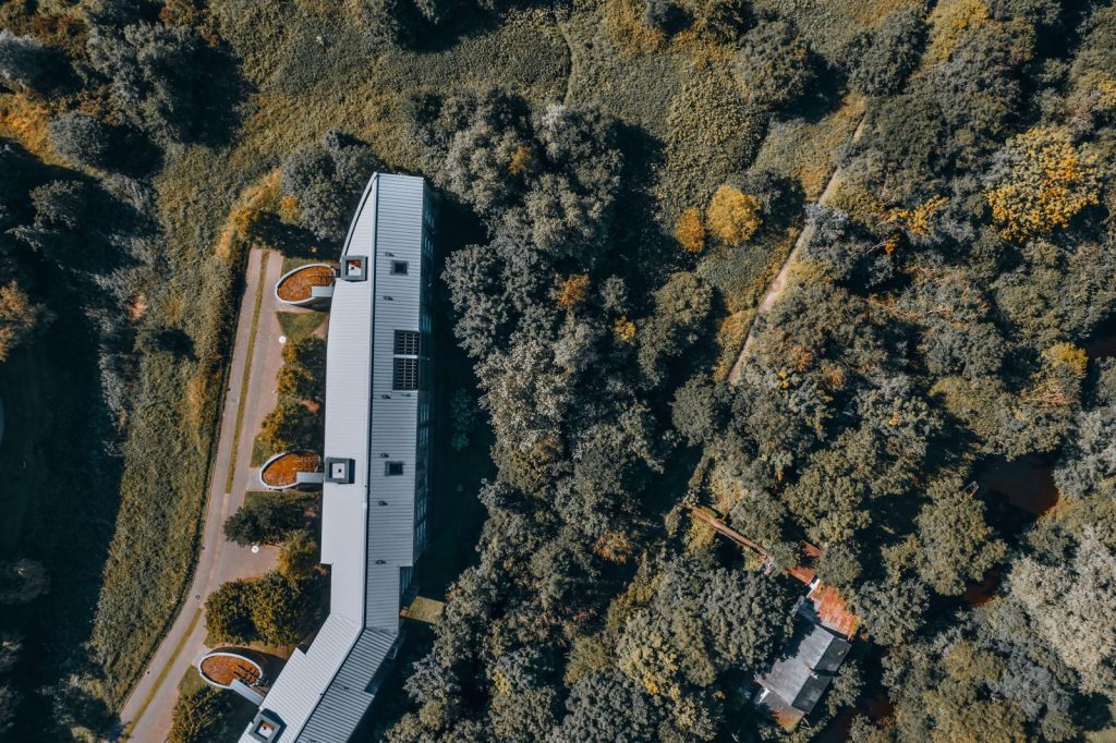 Aerial photo showcasing a building amidst dense greenery in Limerick, Ireland.