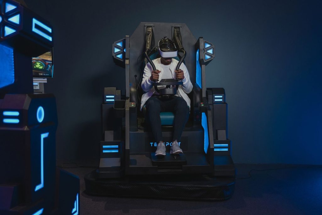 African American man immersed in virtual reality using a VR headset and simulator.