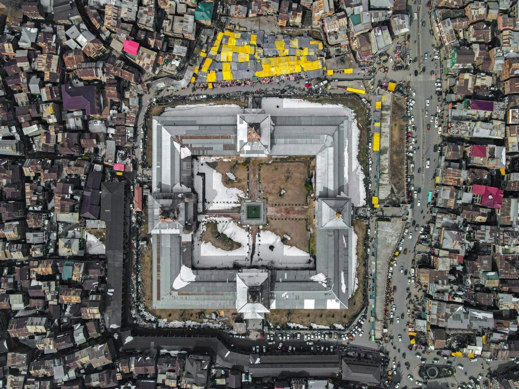 A stunning aerial photograph of Srinagar showcasing a central landmark amidst urban sprawl.