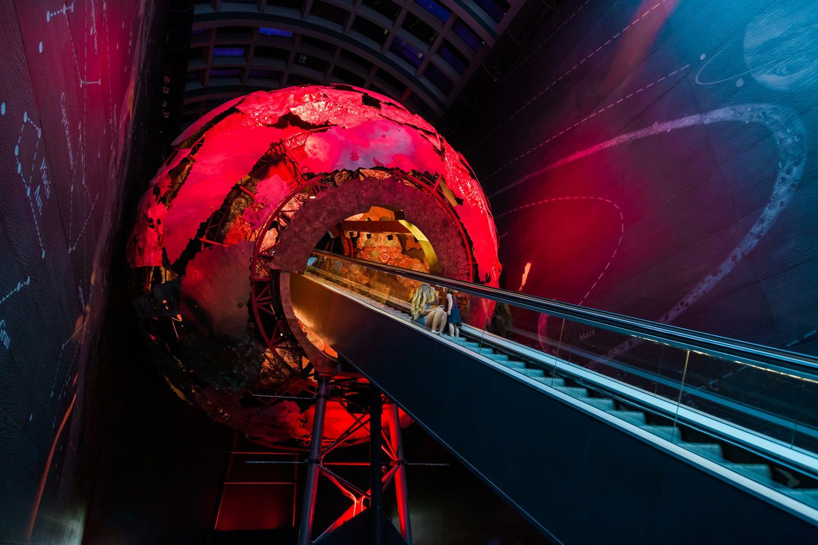 a large red object sitting inside of a tunnel