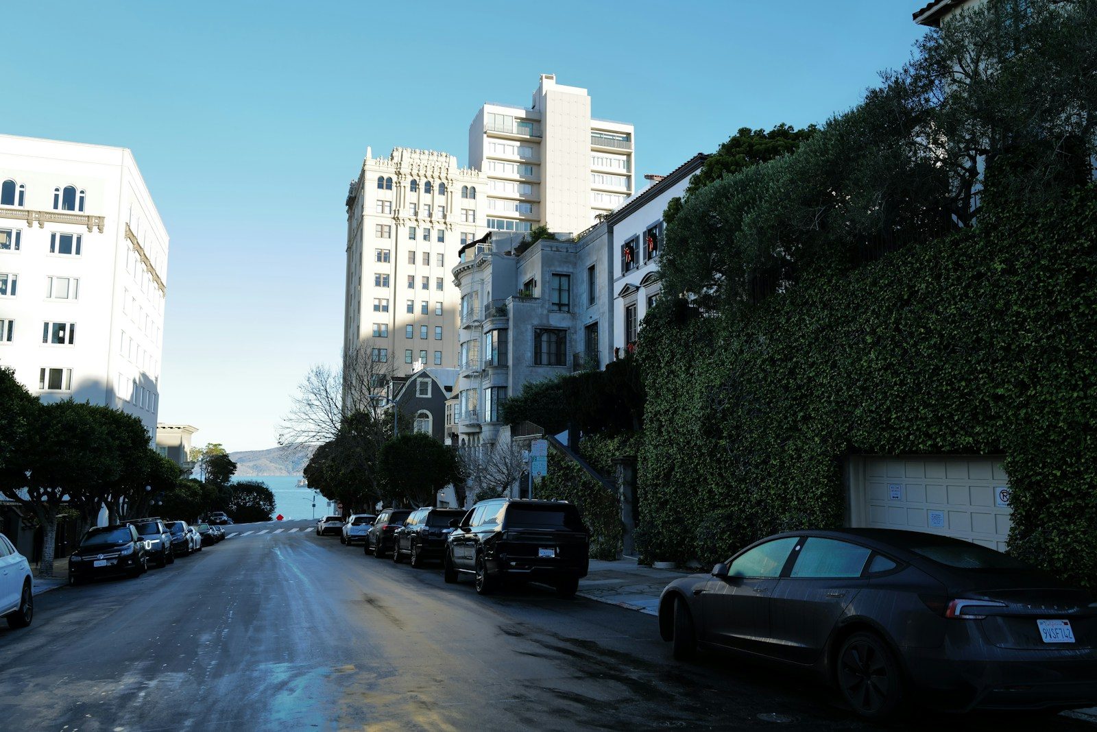 Street view with parked cars and buildings
