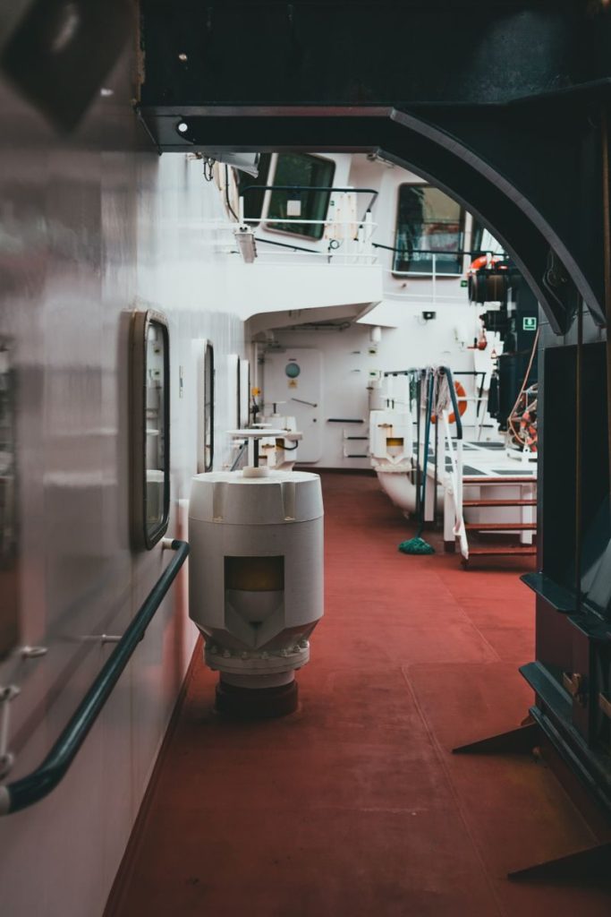 A detailed view inside a ship's corridor, showcasing nautical architecture and design.