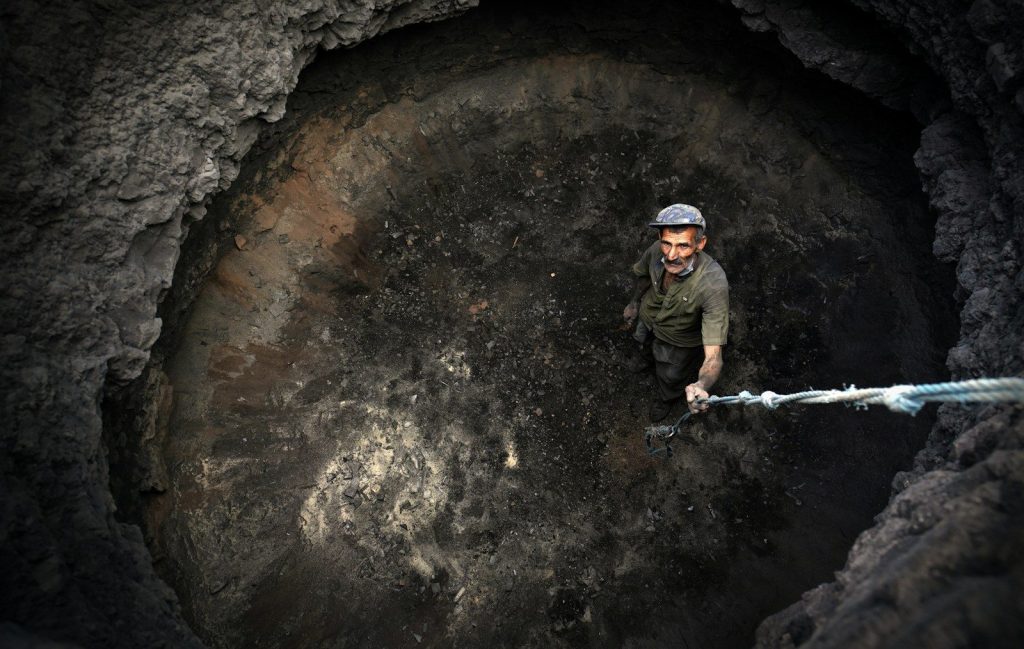 a man climbing a rock wall