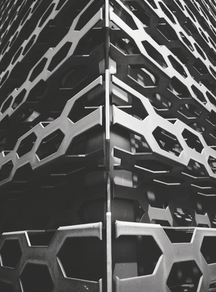 a tall metal structure with many different shapes