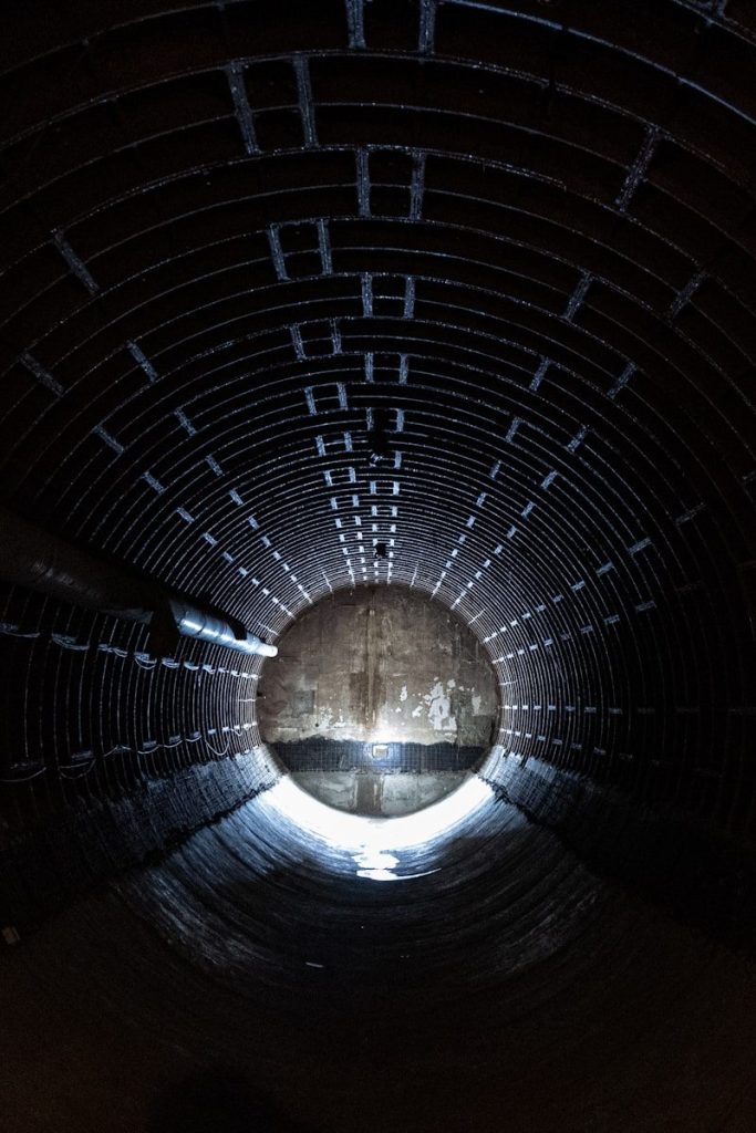 a dark tunnel with a light at the end