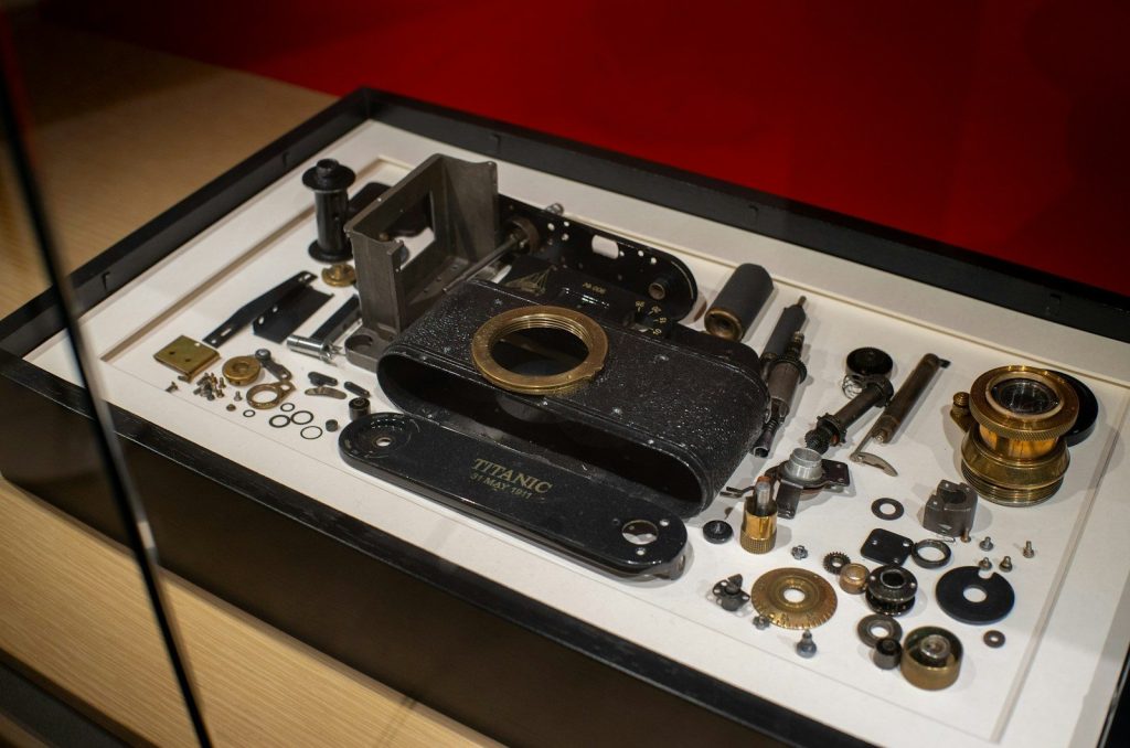 Disassembled vintage camera and its parts arranged components