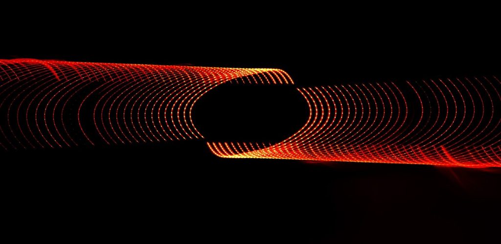 a blurry photo of a red object in the dark