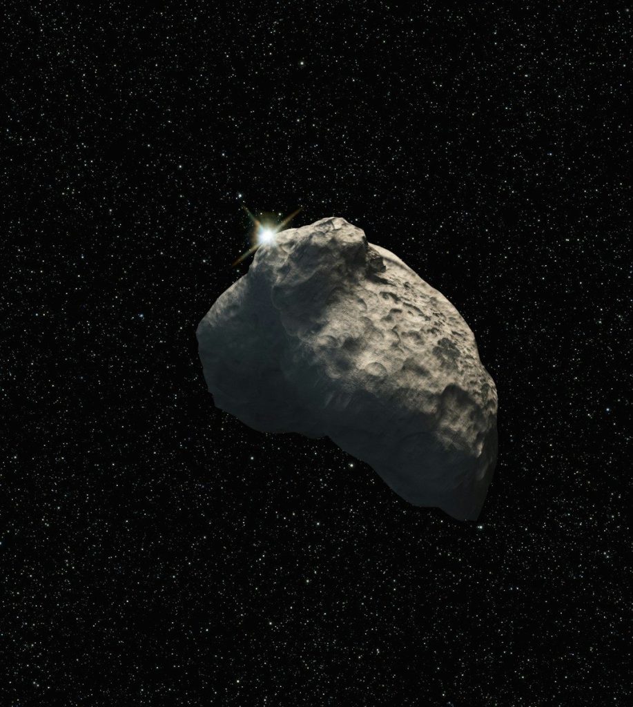 a large rock in the middle of a space filled with stars
