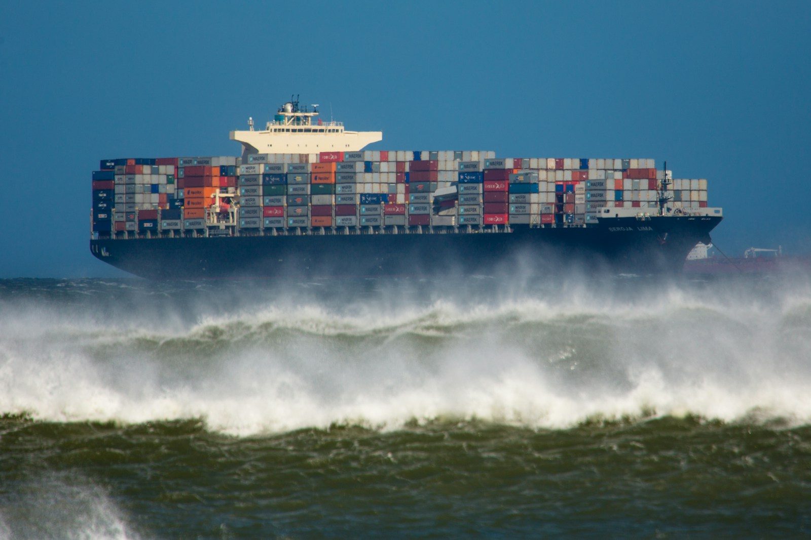 a large container ship in the middle of the ocean