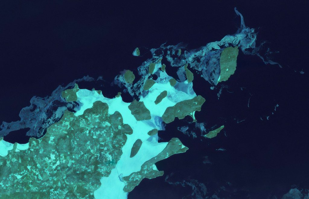 Aerial view of islands and ocean at night