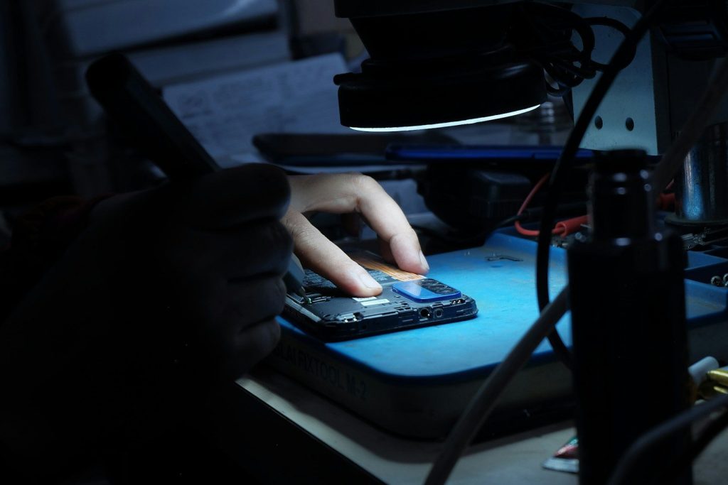 A person using a mouse on a mouse pad