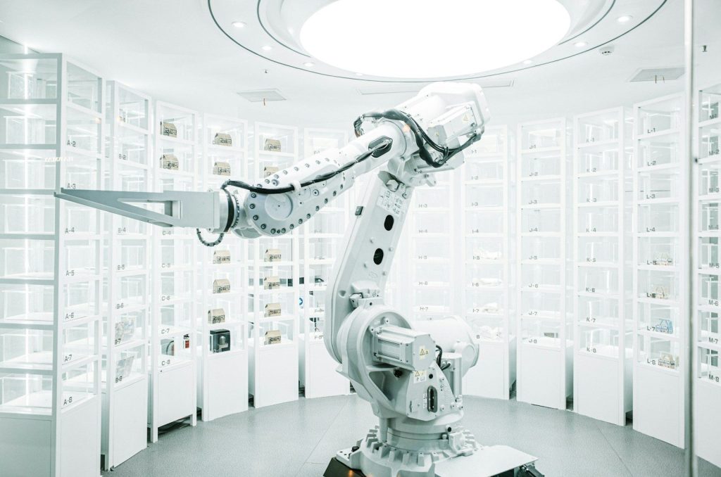 white robotic arm in display showroom