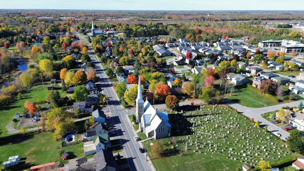 Aerial view of a small town with autumn foliage