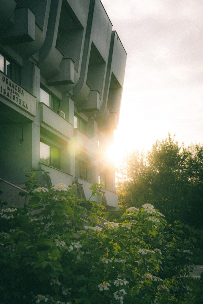 the sun is shining through the windows of a building