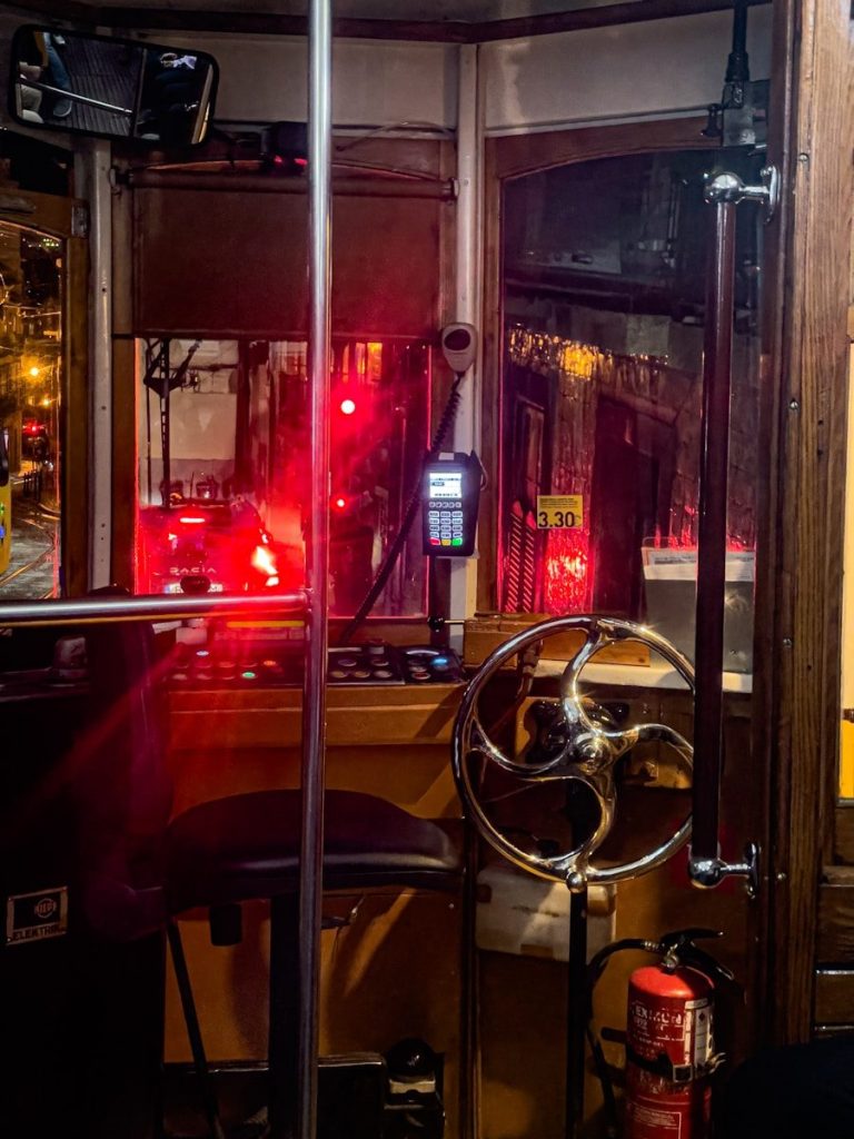 Interior of a vintage tram with red lights