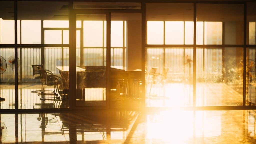 the sun is shining through the windows of a building