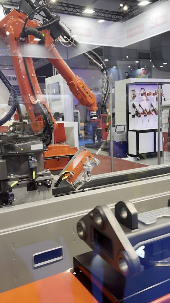 An industrial robot is working inside.