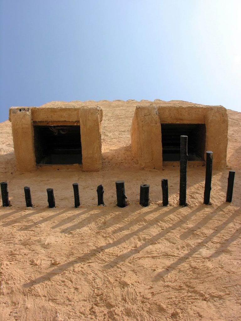 brown concrete blocks on brown sand
