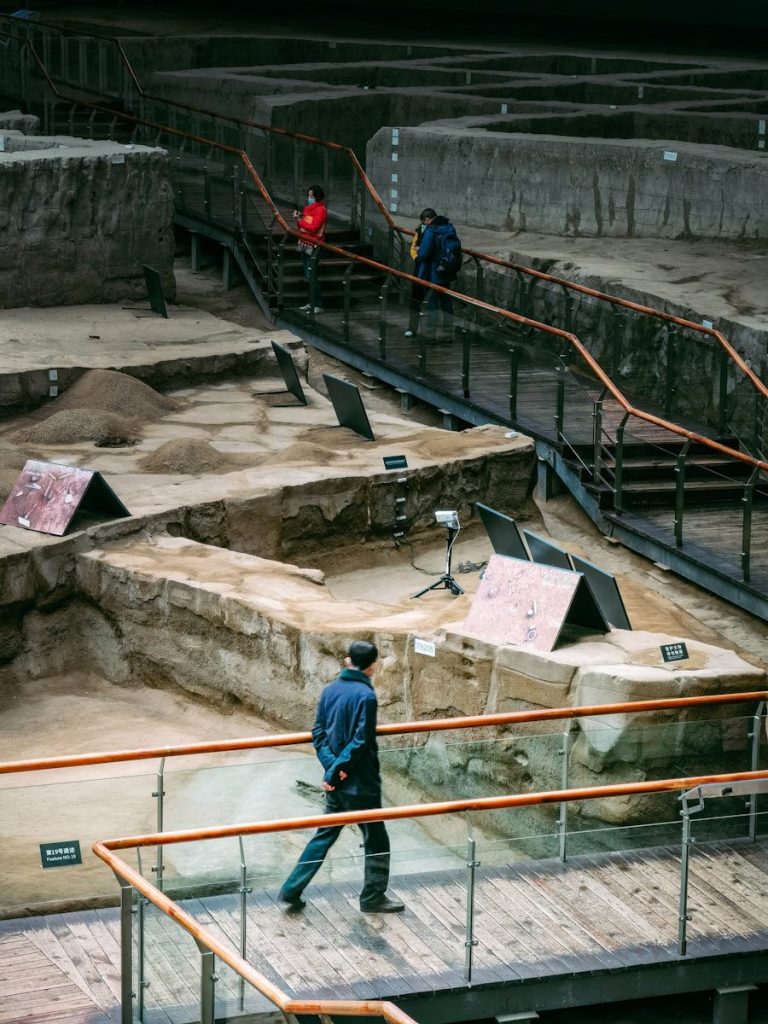 a man standing on top of a wooden ramp