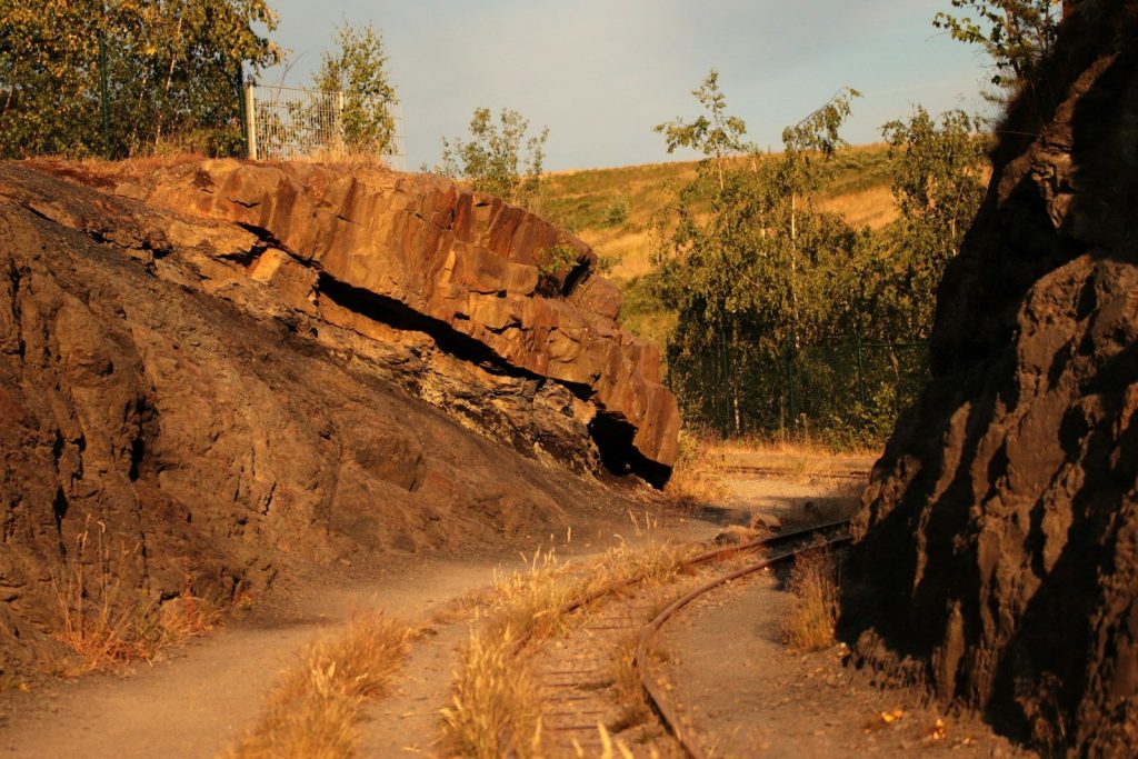 a train track going through a rocky area