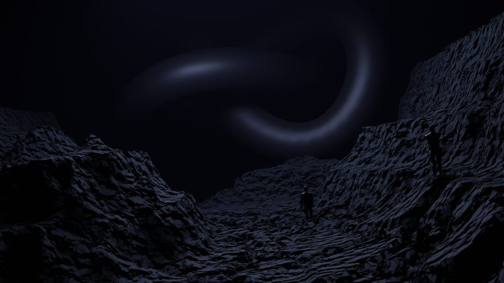 a man standing in the middle of a dark cave