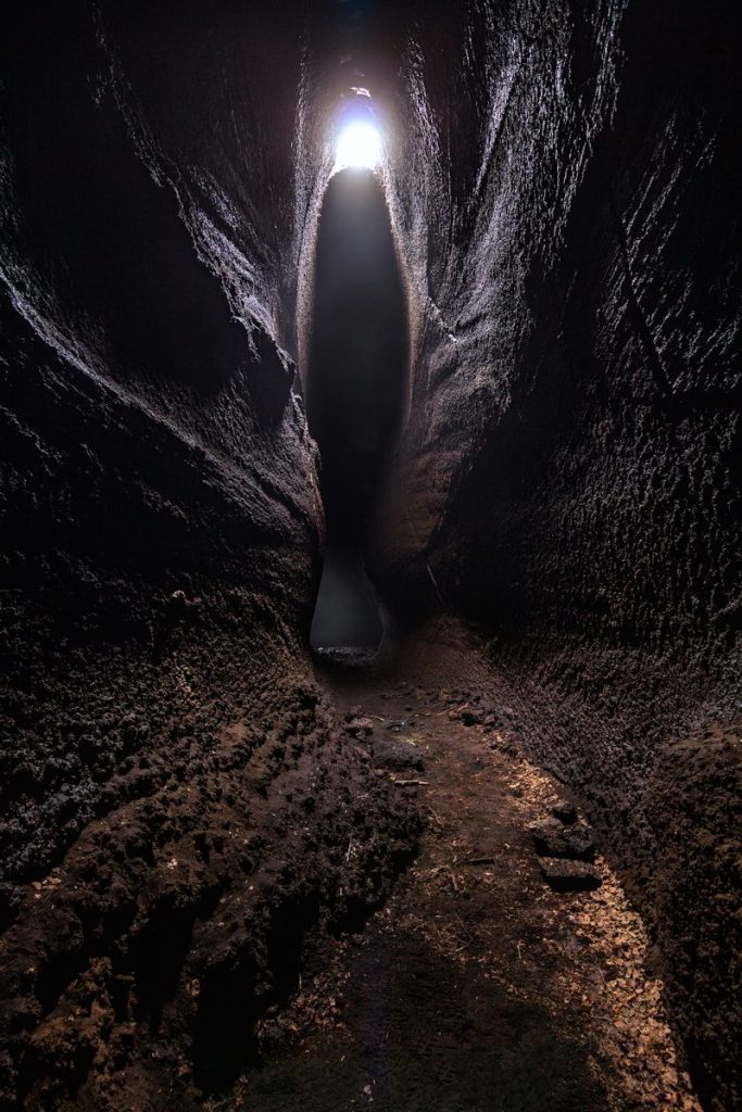 A dark cave with a light at the end.