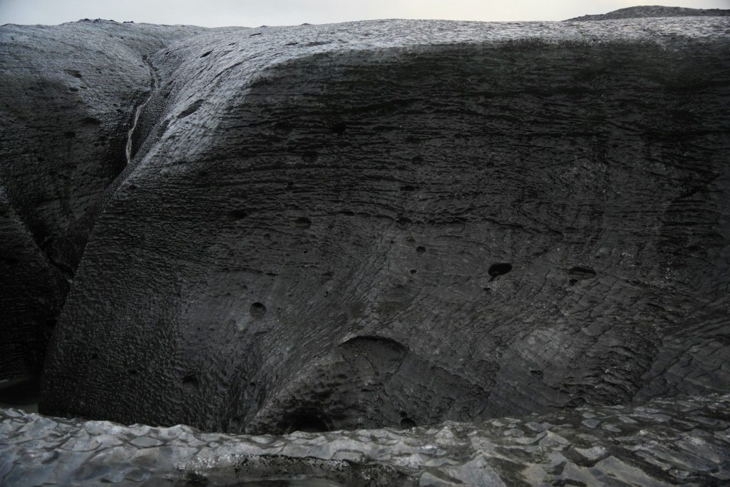A black and white photo of a rock formation