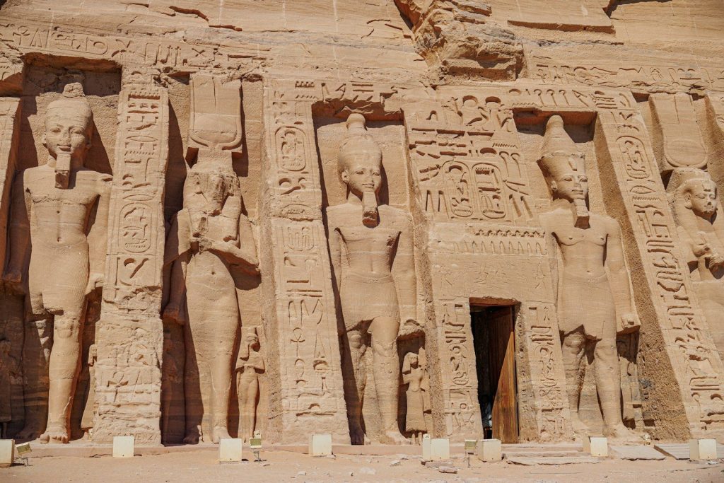 A large building with statues on the side of it
