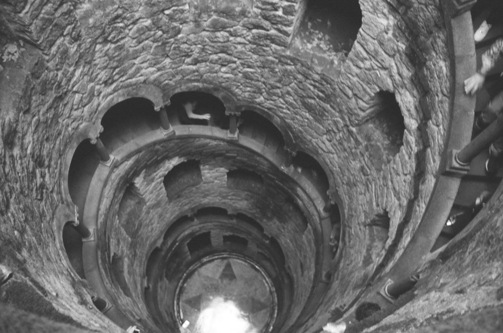Looking up the spiral staircase inside a well.